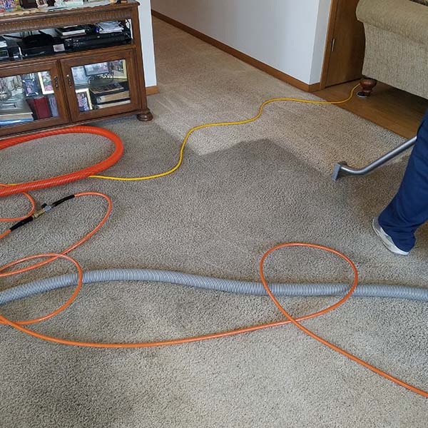 man cleaning carpet